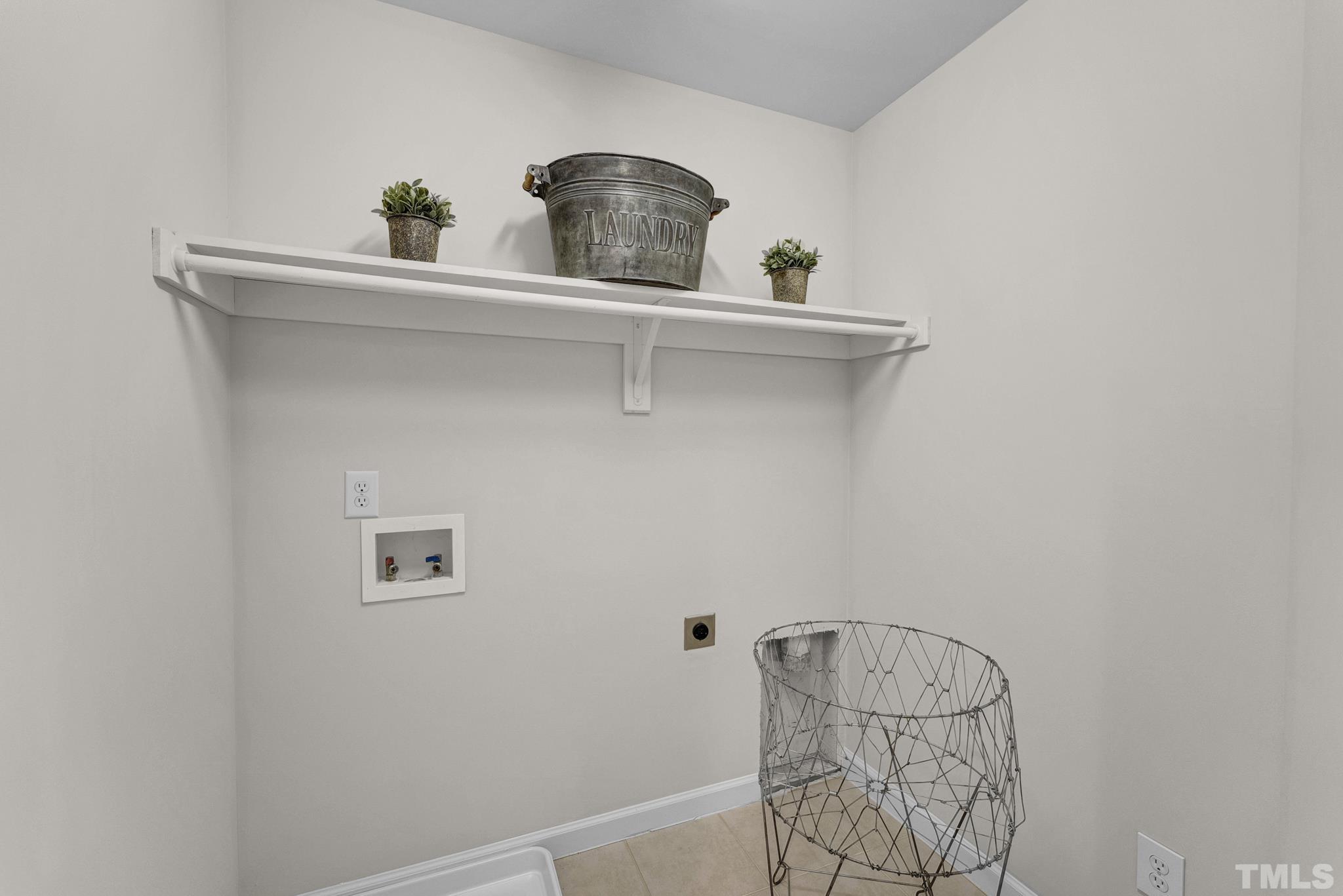 8409 Aptos Court Raleigh, NC 27613 - Photo 35 of 46 a bathroom with a sink and a mirror