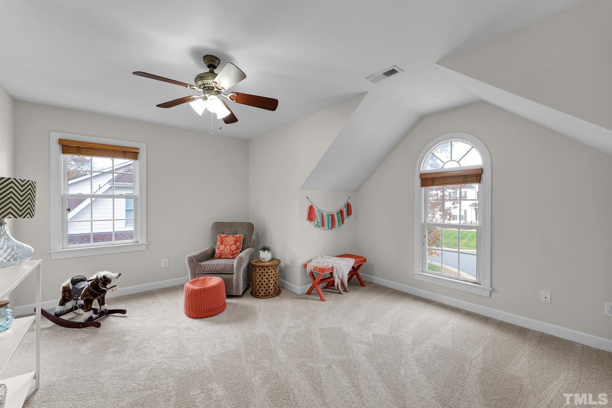 8409 Aptos Court Raleigh, NC 27613 - Photo 36 of 46 a bed room with furniture and a window