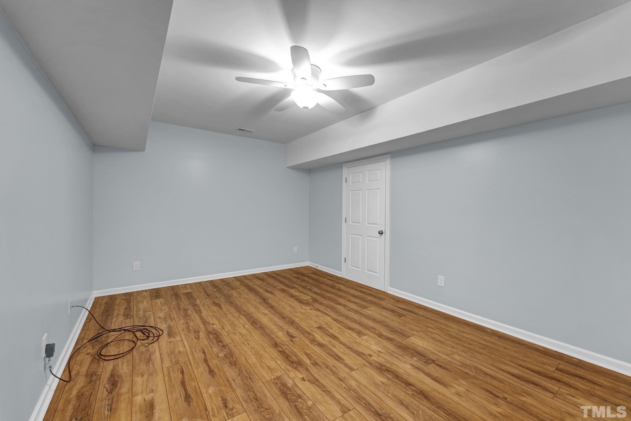 8409 Aptos Court Raleigh, NC 27613 - Photo 40 of 46 wooden floor in an empty room
