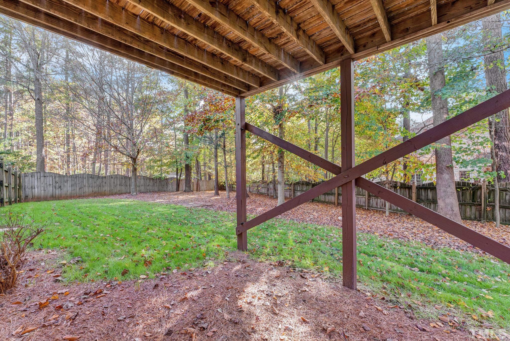 8409 Aptos Court Raleigh, NC 27613 - Photo 43 of 46 a view of a house with backyard and a trees