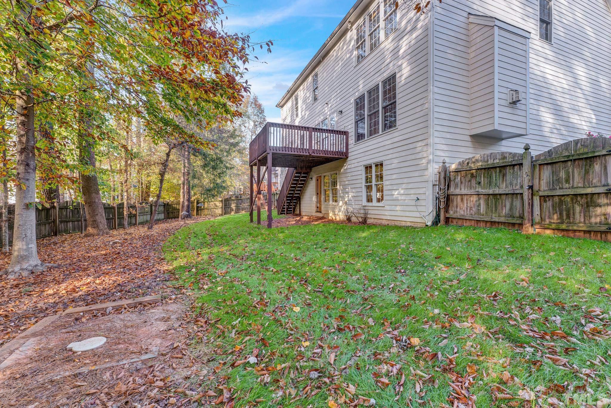 8409 Aptos Court Raleigh, NC 27613 - Photo 45 of 46 a view of a house with yard and a tree
