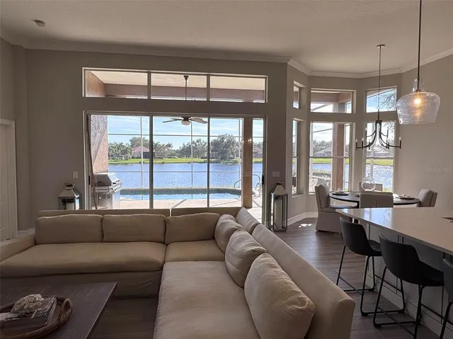 a large kitchen with stainless steel appliances kitchen island granite countertop a large island in the center