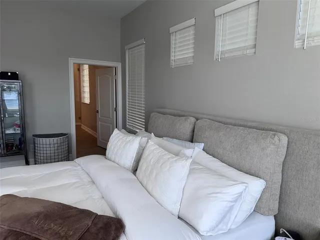 a bedroom with a bed and walk in closet