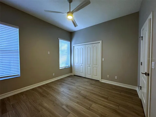 an aerial view of a houses with swimming pool