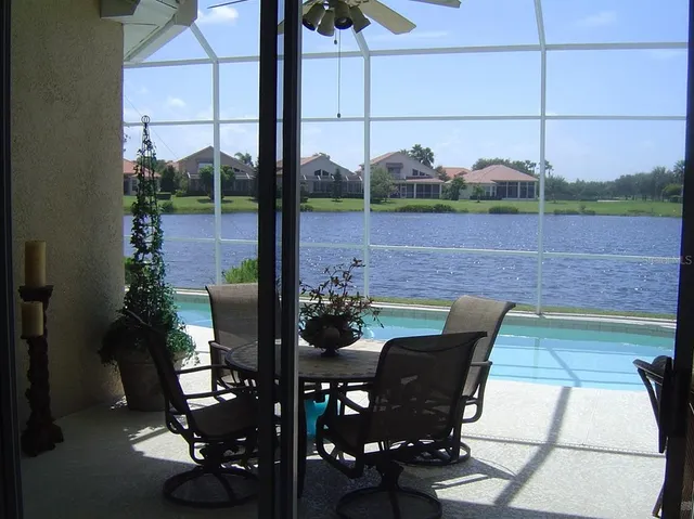 a view of a chairs and table in the patio