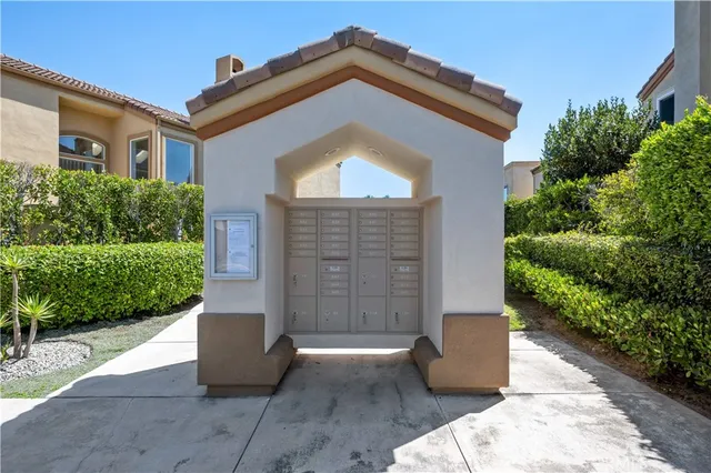 a view of a house with a small yard and plants