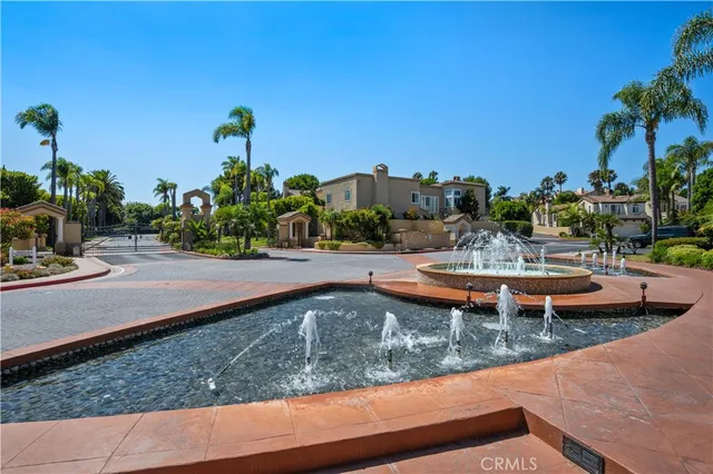 swimming pool view with a garden