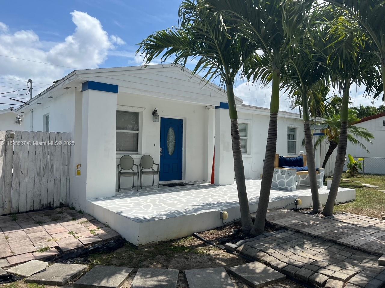7595 Southwest 28th Street Miami, FL 33155 - Photo 7 of 8 a view of a house with backyard and a tree