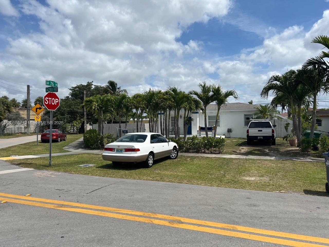 7595 Southwest 28th Street Miami, FL 33155 - Photo 8 of 8 a view of street with parked cars
