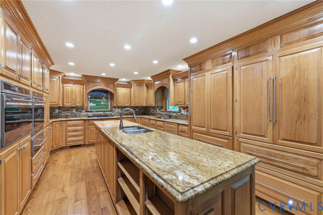 3201 East Brigstock Road Midlothian, VA 23113 - Photo 13 of 72 a kitchen with stainless steel appliances granite countertop a sink and counter space