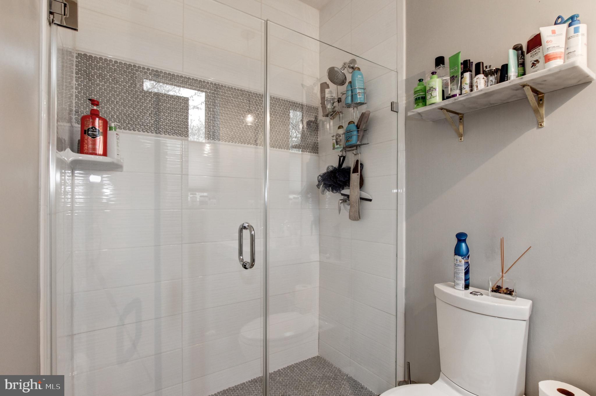 37 Todd Place Northeast, Unit 3 Washington, DC 20002 - Photo 17 of 28 a bathroom with a shower and a toilet