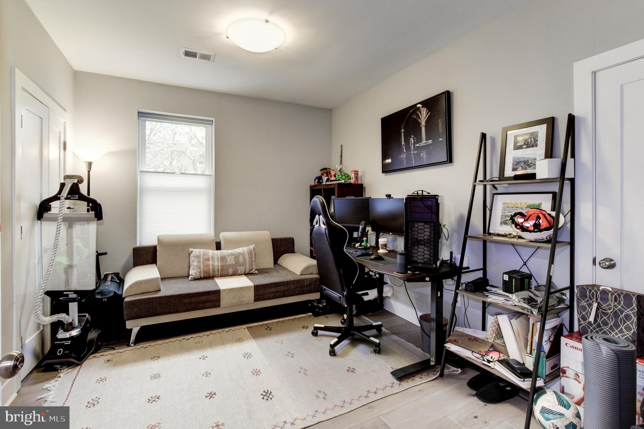 37 Todd Place Northeast, Unit 3 Washington, DC 20002 - Photo 20 of 28 a living room with furniture and a window