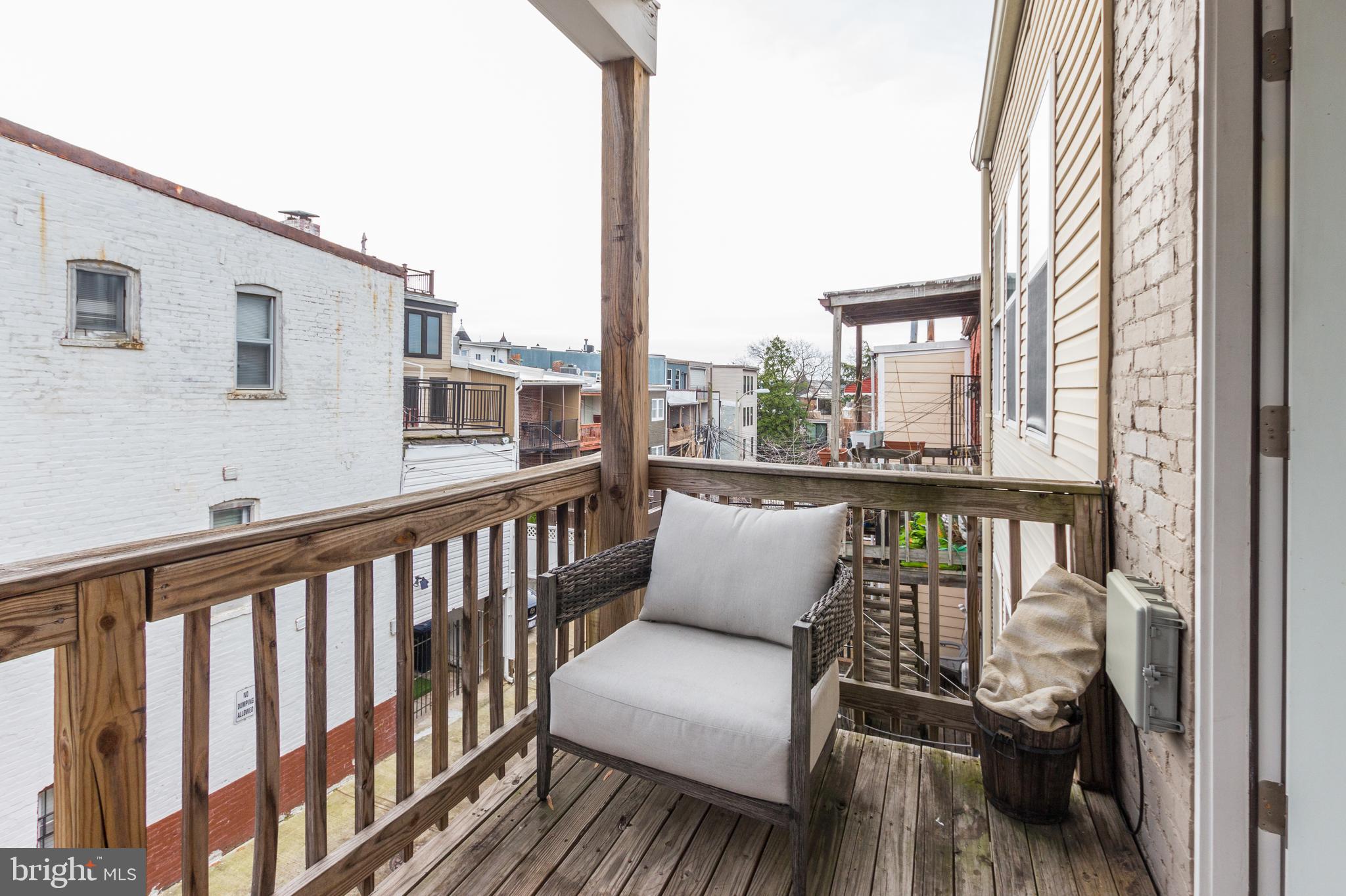 37 Todd Place Northeast, Unit 3 Washington, DC 20002 - Photo 21 of 28 a view of a balcony with wooden floor