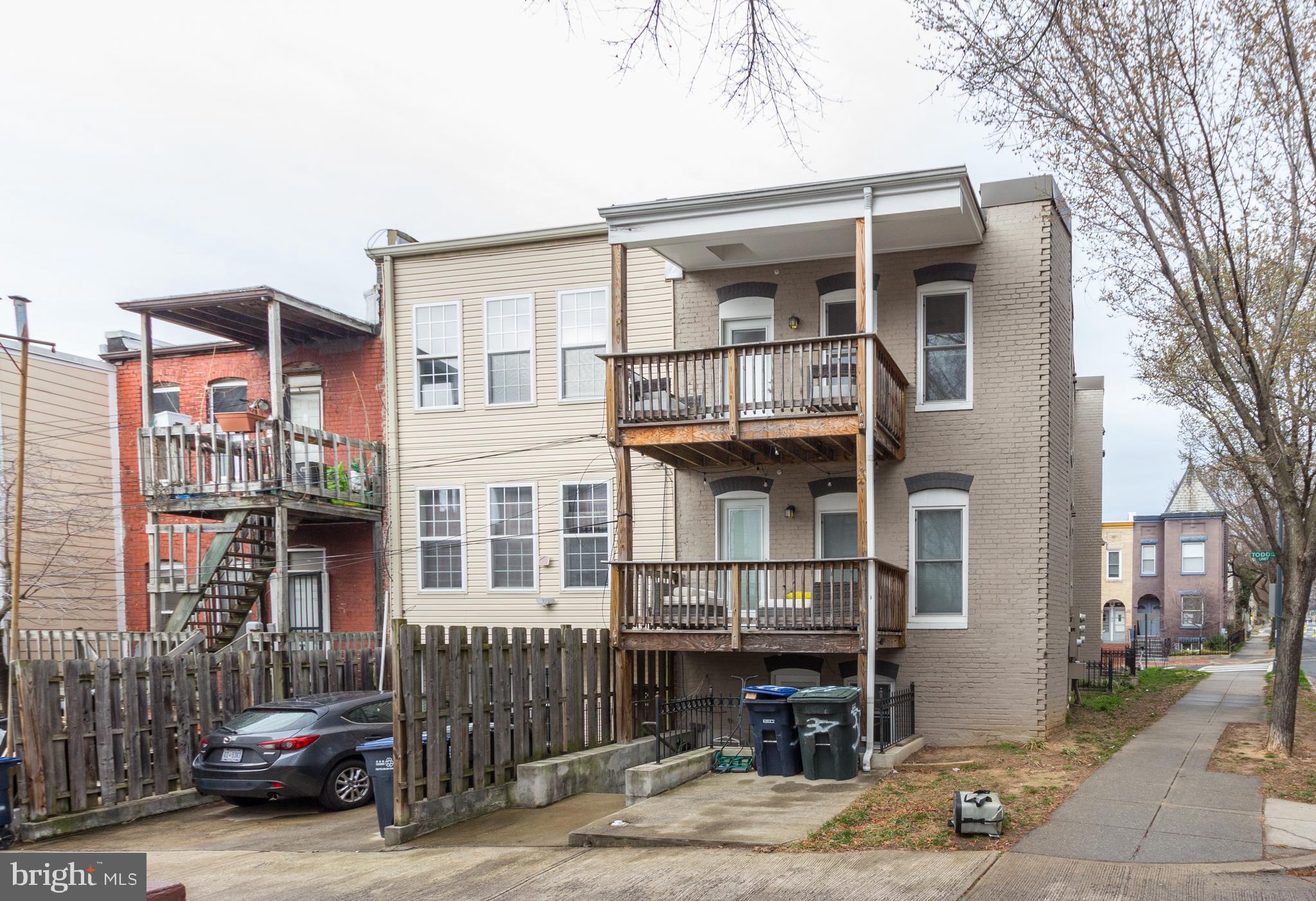 37 Todd Place Northeast, Unit 3 Washington, DC 20002 - Photo 24 of 28 a front view of a house with parking