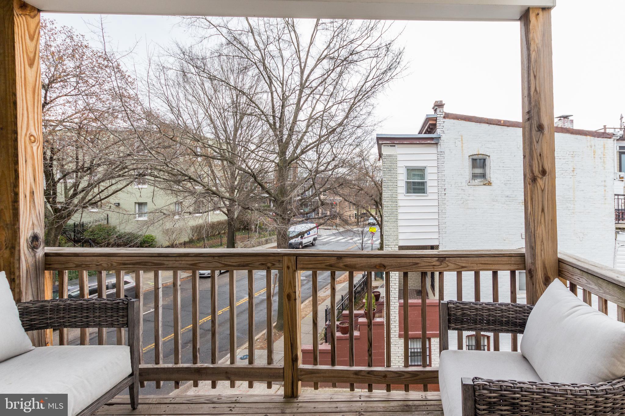 37 Todd Place Northeast, Unit 3 Washington, DC 20002 - Photo 26 of 28 a view of a roof deck with wooden fence and wooden floor