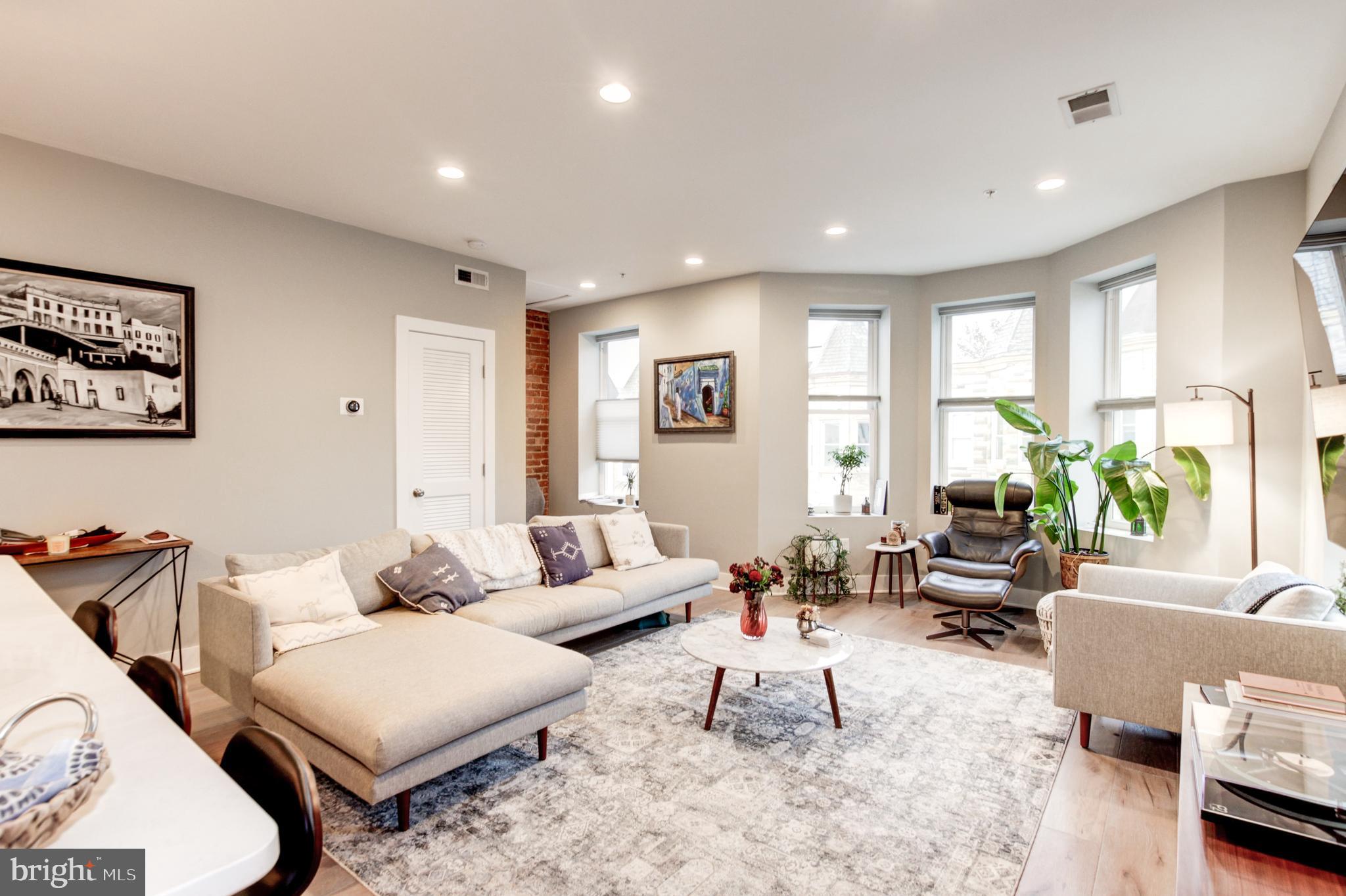 37 Todd Place Northeast, Unit 3 Washington, DC 20002 - Photo 5 of 28 a living room with furniture and wooden floor