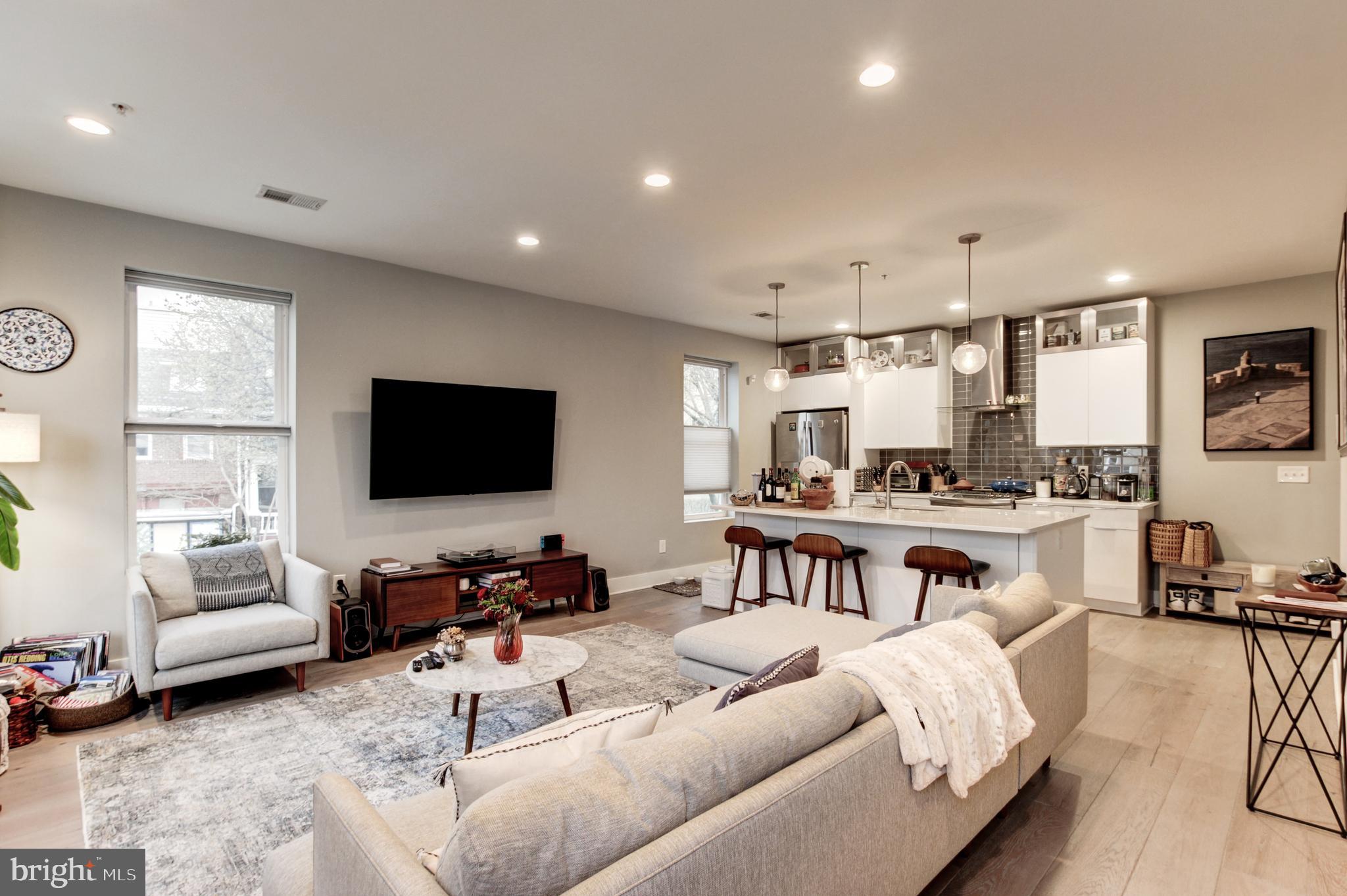 37 Todd Place Northeast, Unit 3 Washington, DC 20002 - Photo 6 of 28 a living room with furniture and a flat screen tv