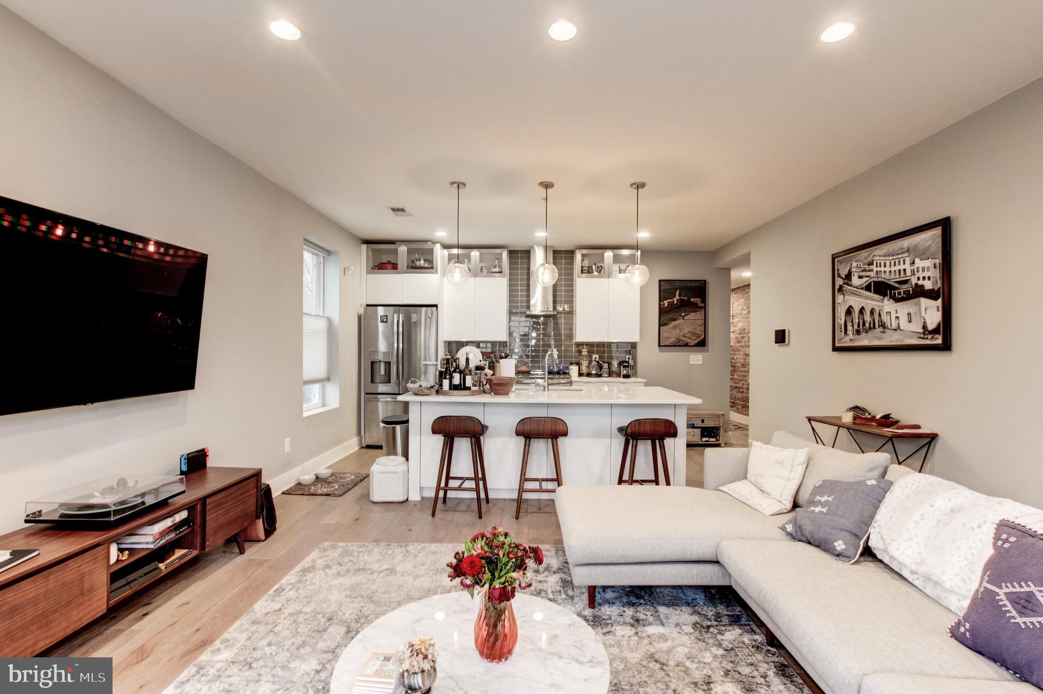 37 Todd Place Northeast, Unit 3 Washington, DC 20002 - Photo 7 of 28 a living room with furniture and a flat screen tv