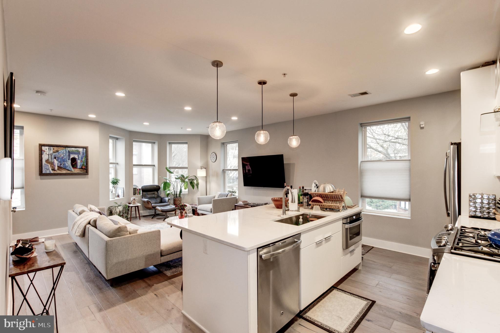 37 Todd Place Northeast, Unit 3 Washington, DC 20002 - Photo 8 of 28 a living room with furniture and a flat screen tv