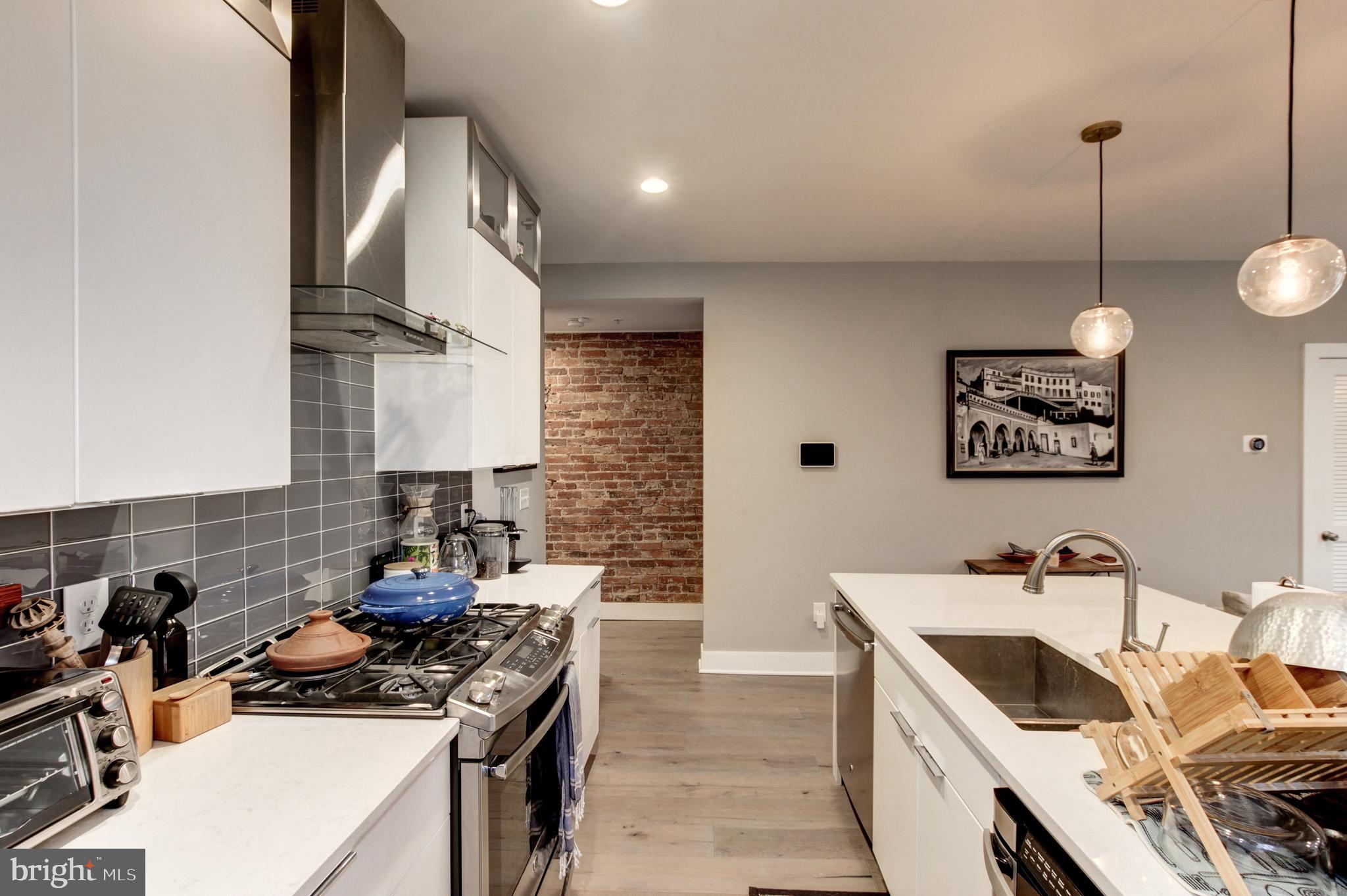 37 Todd Place Northeast, Unit 3 Washington, DC 20002 - Photo 9 of 28 a kitchen that has a lot of cabinets in it
