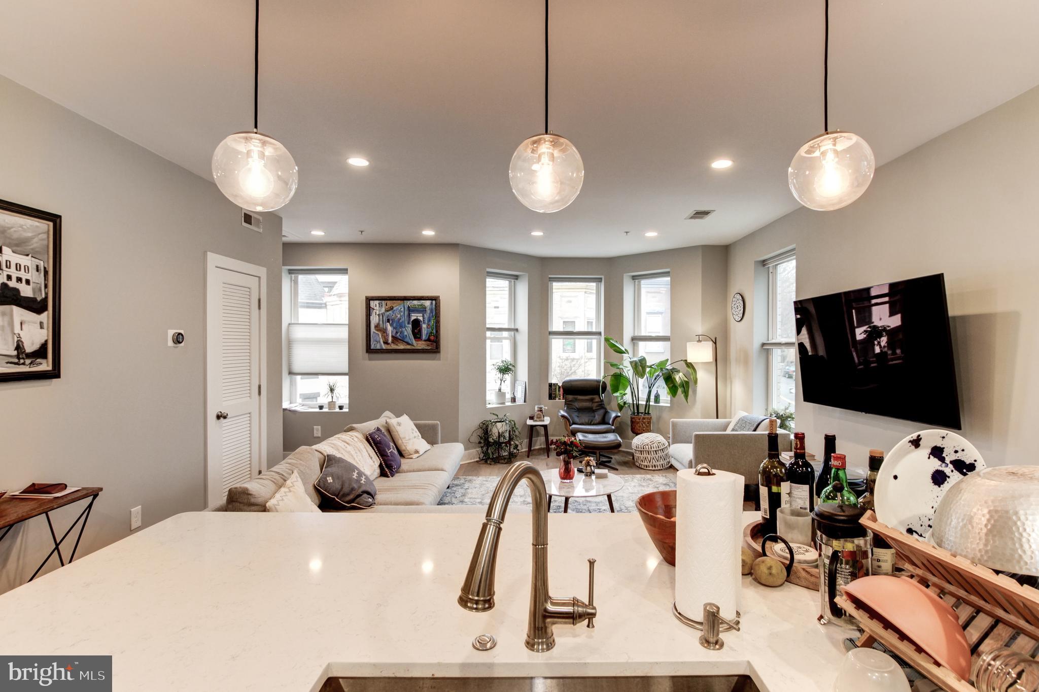 37 Todd Place Northeast, Unit 3 Washington, DC 20002 - Photo 10 of 28 a view of a dining room with furniture and a flat screen tv