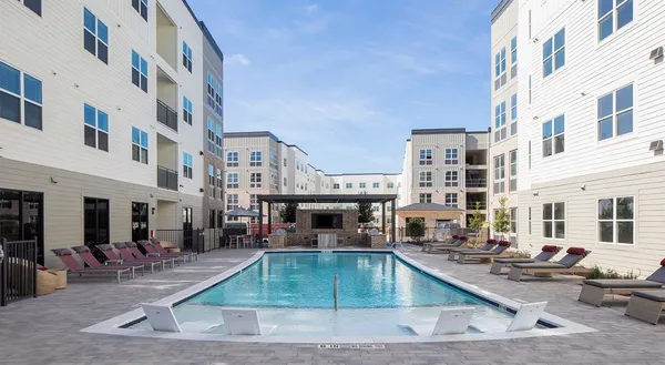 a view of a building with a swimming pool