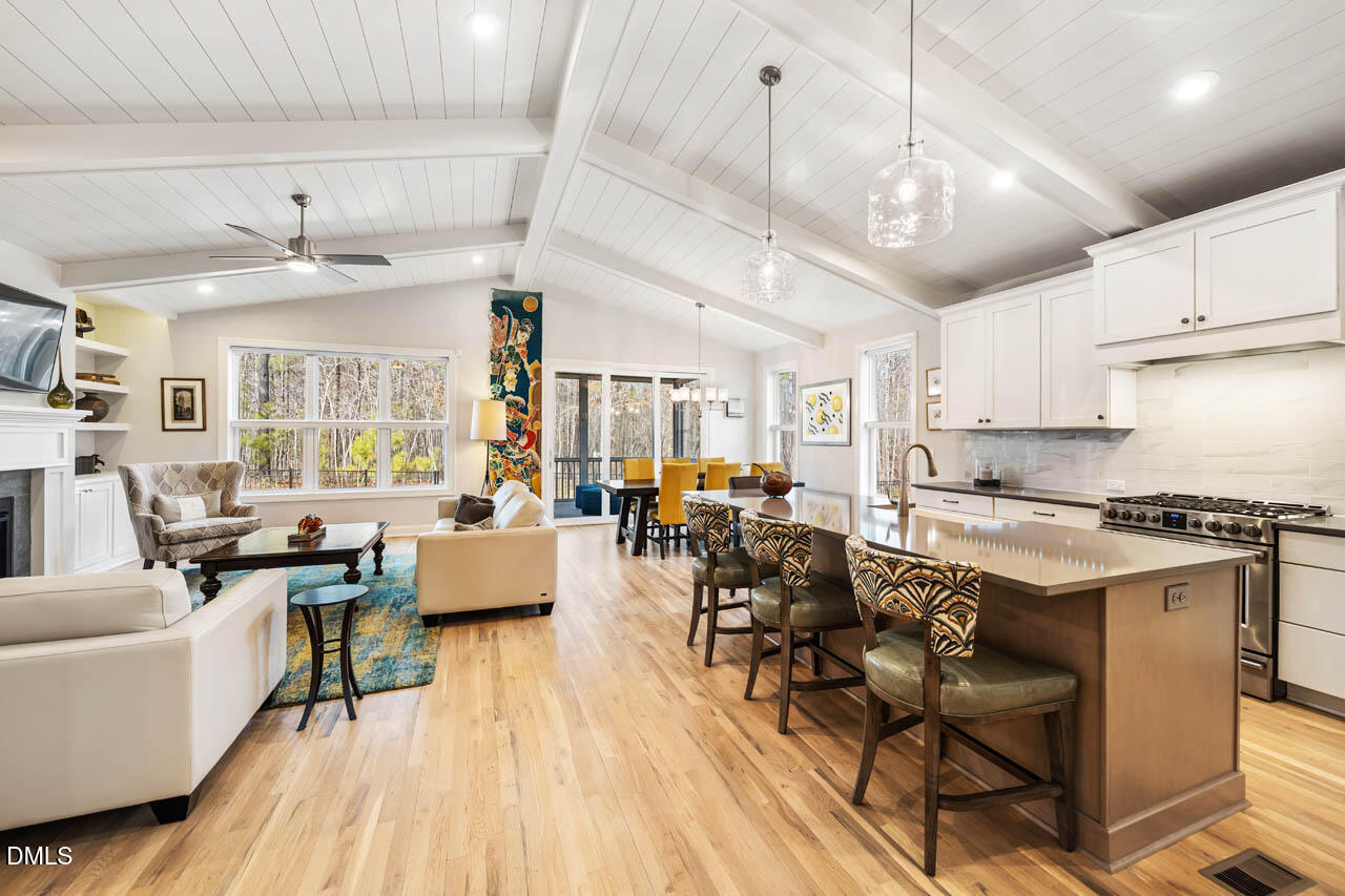45 Post Oak Road Chapel Hill, NC 27516 - Photo 10 of 89 a living room with lots of furniture and kitchen view