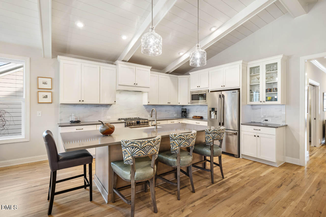 45 Post Oak Road Chapel Hill, NC 27516 - Photo 12 of 89 a view of kitchen with refrigerator a dining table and chairs