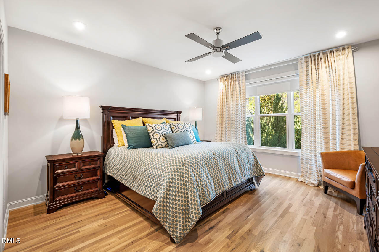 45 Post Oak Road Chapel Hill, NC 27516 - Photo 21 of 89 a bedroom with a bed and wooden floor