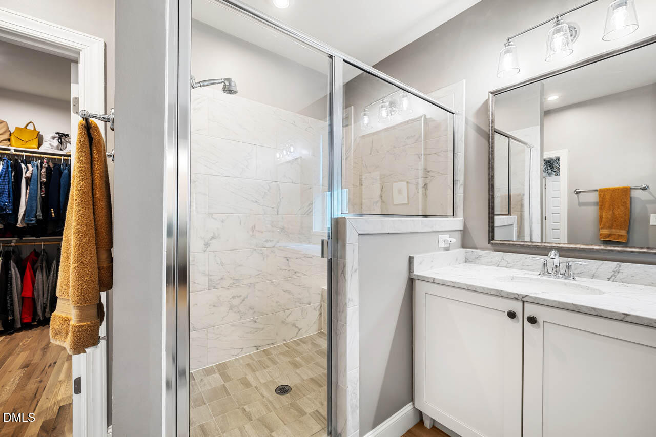 45 Post Oak Road Chapel Hill, NC 27516 - Photo 24 of 89 a bathroom with a sink and a mirror
