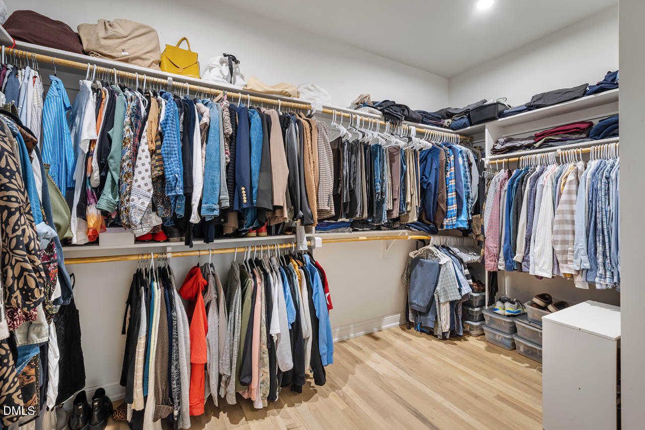 45 Post Oak Road Chapel Hill, NC 27516 - Photo 25 of 89 a view of walk in closet with clothes and shoes