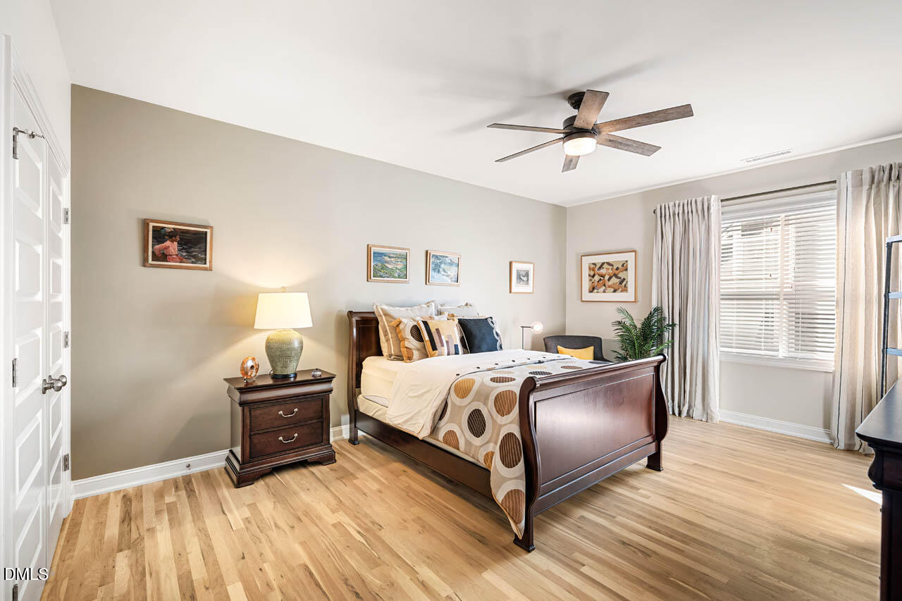 45 Post Oak Road Chapel Hill, NC 27516 - Photo 32 of 89 a spacious bedroom with a bed and wooden floor