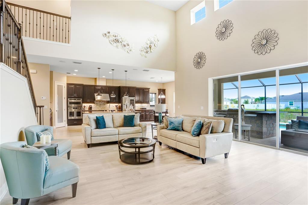 32450 Talimena Loop Wesley Chapel, FL 33543 - Photo 13 of 68 a living room with furniture kitchen view and a large window