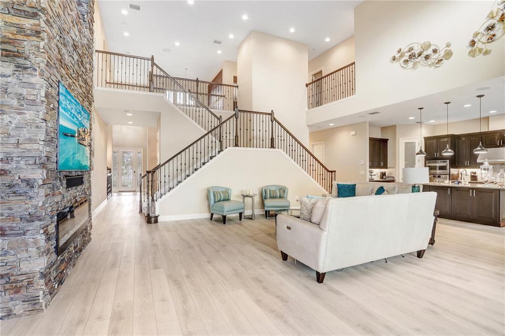 32450 Talimena Loop Wesley Chapel, FL 33543 - Photo 14 of 68 a living room with furniture and stairs