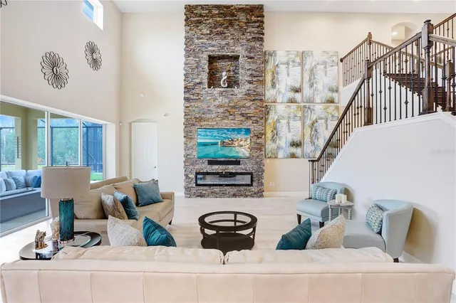 a open kitchen with stainless steel appliances granite countertop a sink a stove and a refrigerator