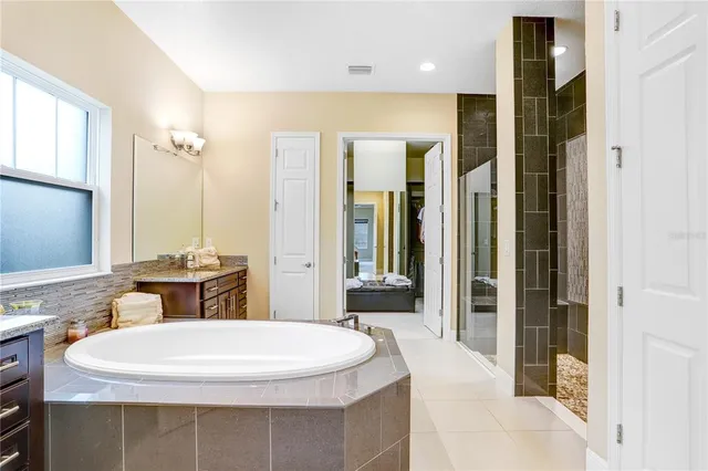 a kitchen with stainless steel appliances granite countertop a sink and stove