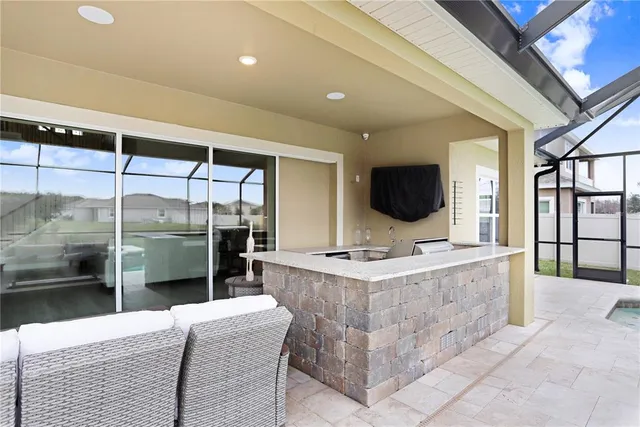 an aerial view of a residential houses with outdoor space and river view
