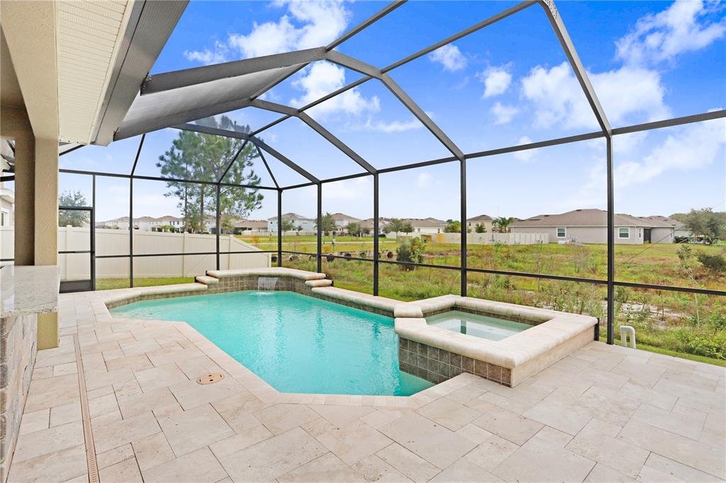 32450 Talimena Loop Wesley Chapel, FL 33543 - Photo 45 of 68 a view of a swimming pool with a porch