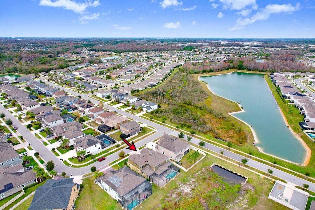 32450 Talimena Loop Wesley Chapel, FL 33543 - Photo 62 of 68 an aerial view of a residential houses with outdoor space and river view