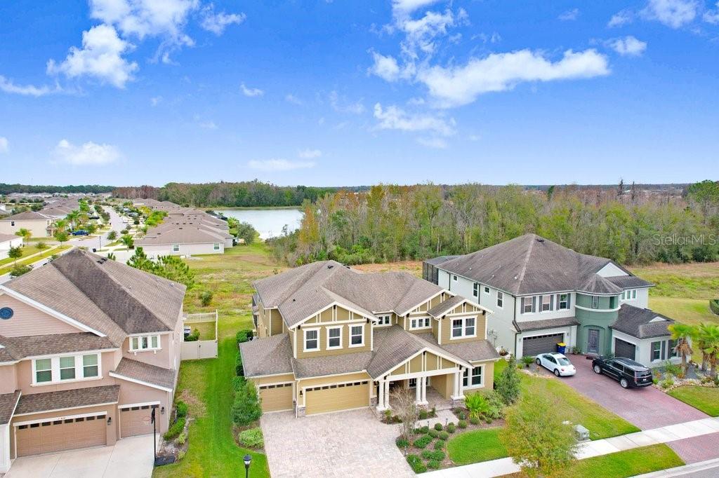 32450 Talimena Loop Wesley Chapel, FL 33543 - Photo 66 of 68 an aerial view of residential houses with outdoor space and trees