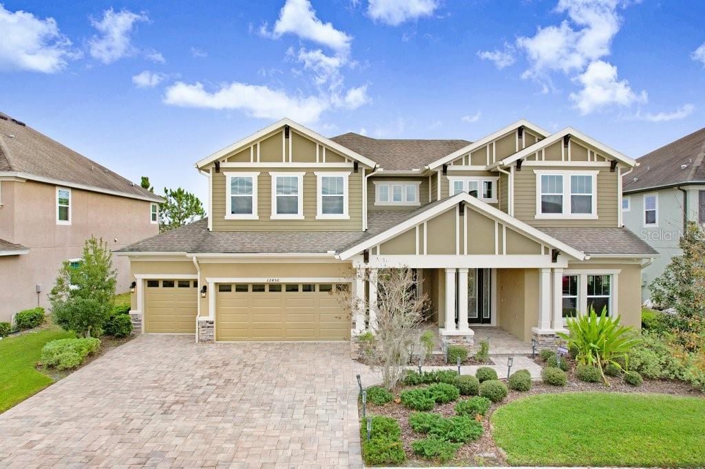 32450 Talimena Loop Wesley Chapel, FL 33543 - Photo 68 of 68 a front view of a house with garden