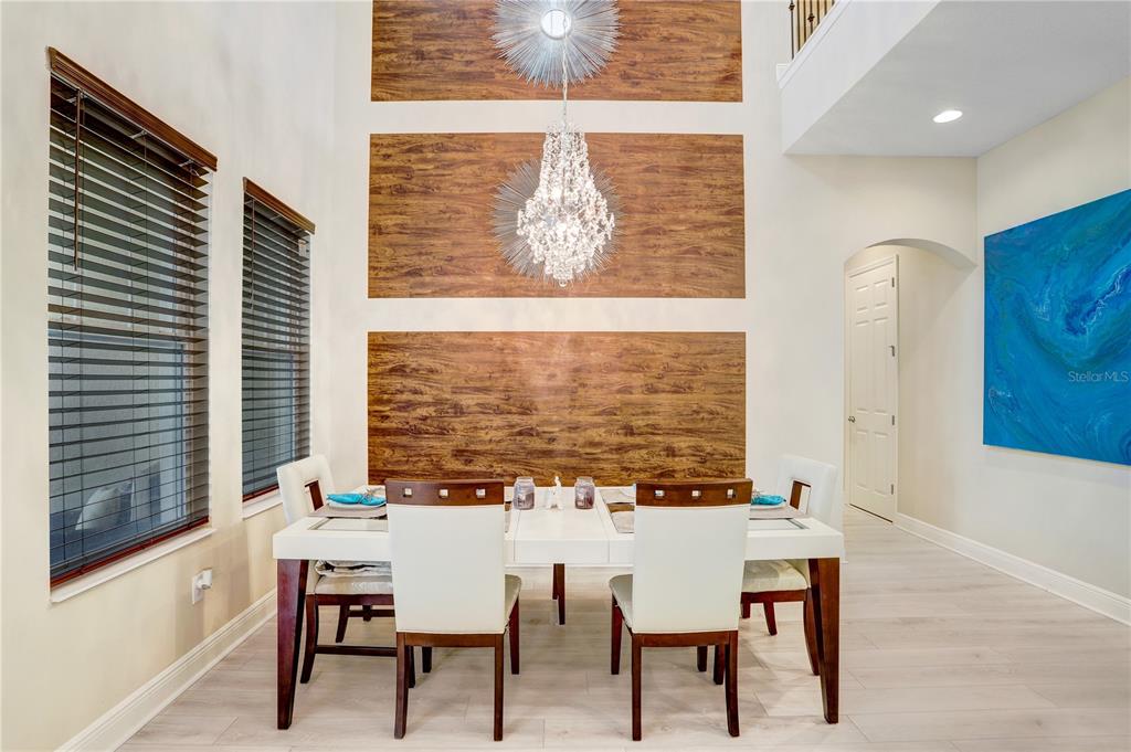 32450 Talimena Loop Wesley Chapel, FL 33543 - Photo 9 of 68 a view of a dining room with furniture and window