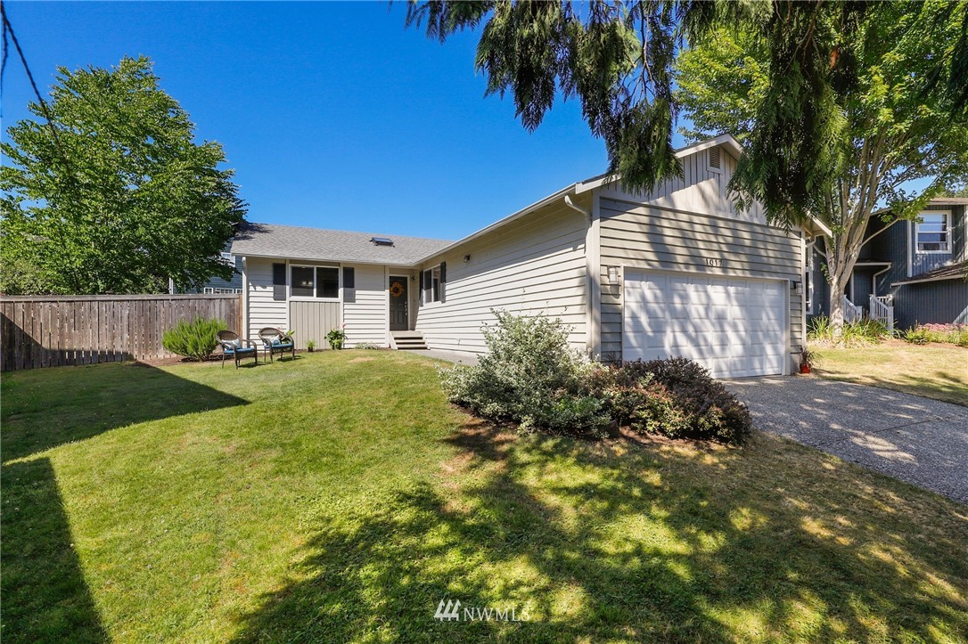 1017 234th Place Southwest Bothell, WA 98021 - Photo 2 of 28 a front view of a house with garden