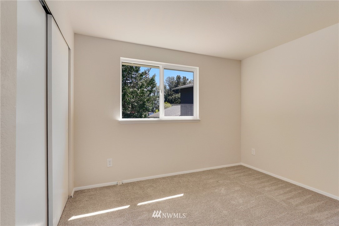 1017 234th Place Southwest Bothell, WA 98021 - Photo 16 of 28 a view of an empty room with a window