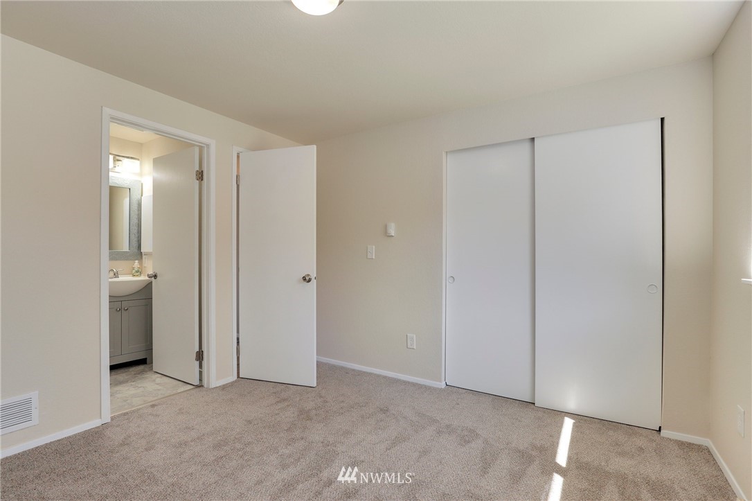 1017 234th Place Southwest Bothell, WA 98021 - Photo 17 of 28 a view of an empty room with a bathroom