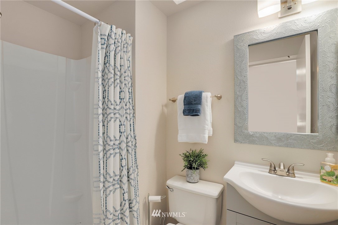 1017 234th Place Southwest Bothell, WA 98021 - Photo 18 of 28 a bathroom with a sink toilet and shower