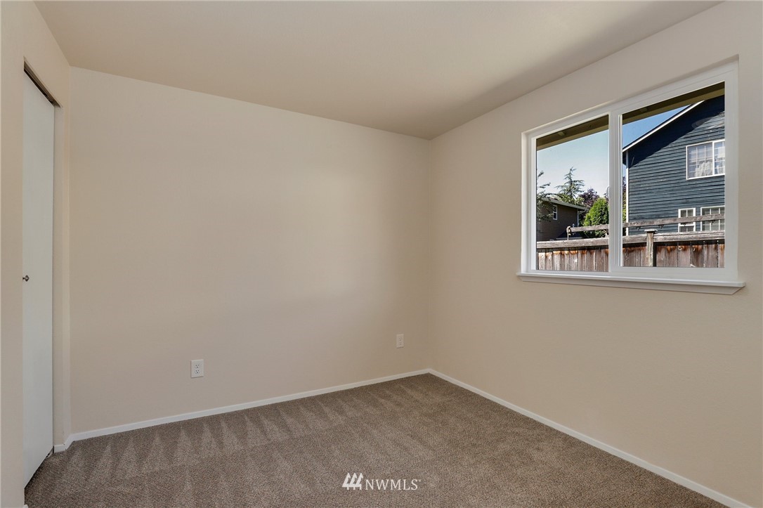 1017 234th Place Southwest Bothell, WA 98021 - Photo 21 of 28 a view of an empty room with a window