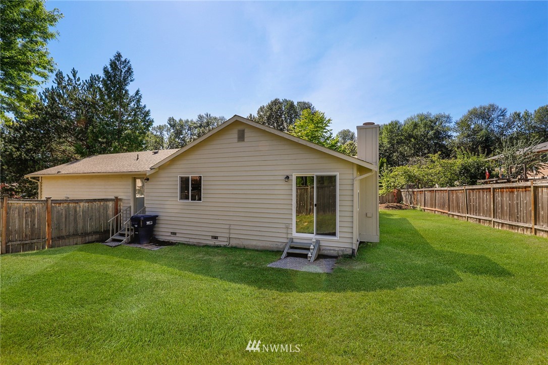 1017 234th Place Southwest Bothell, WA 98021 - Photo 23 of 28 a front view of house with a garden