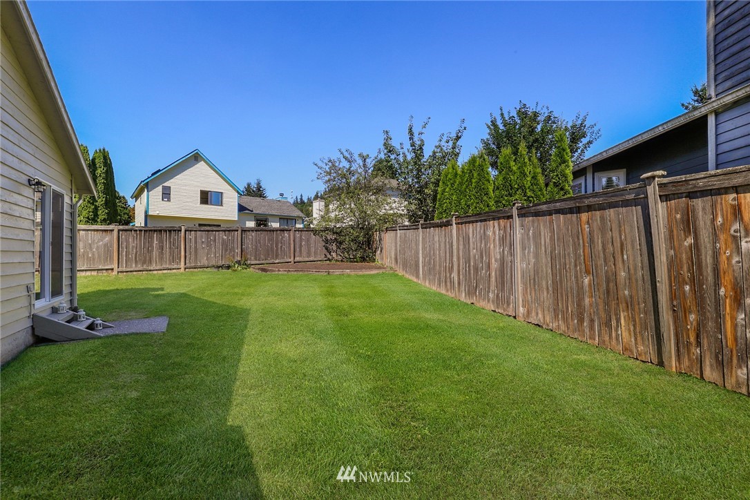 1017 234th Place Southwest Bothell, WA 98021 - Photo 24 of 28 a front view of a house with garden