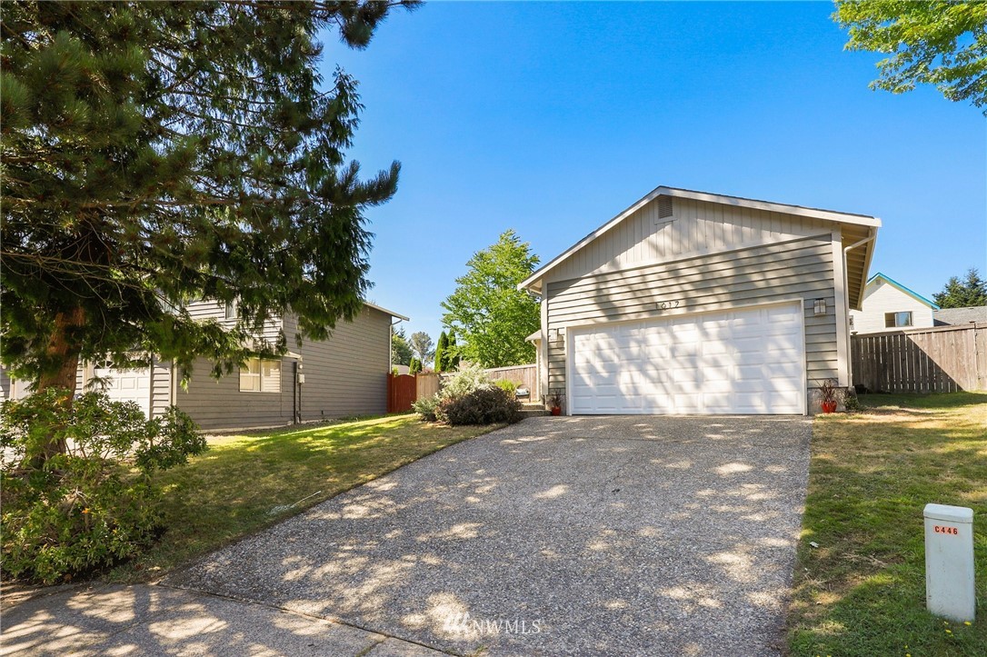 1017 234th Place Southwest Bothell, WA 98021 - Photo 27 of 28 a view of a house with a yard